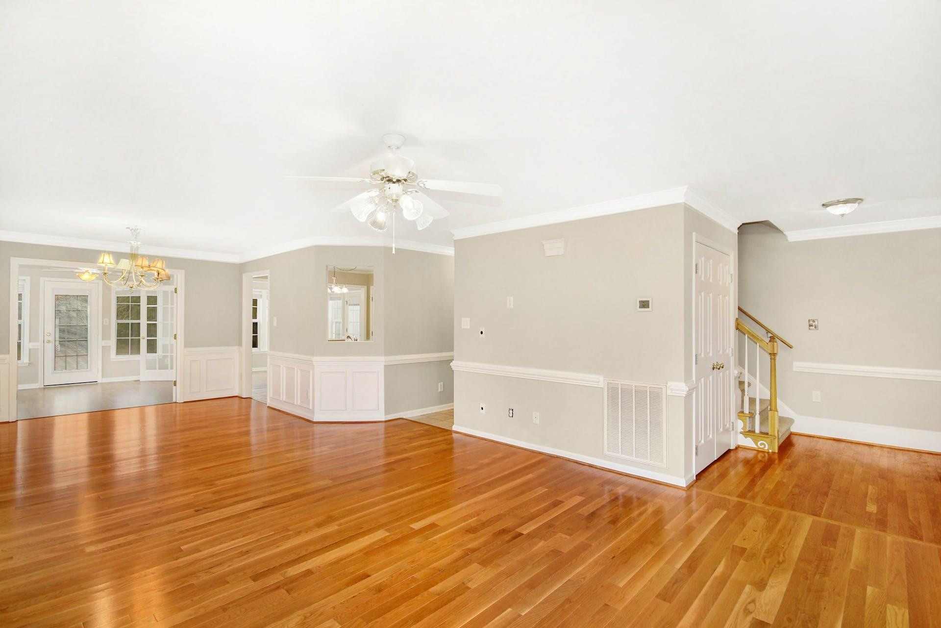 143 Susan Drive Garner, NC 27529 - Photo 6 of 27 a view of empty room with wooden floor and fan