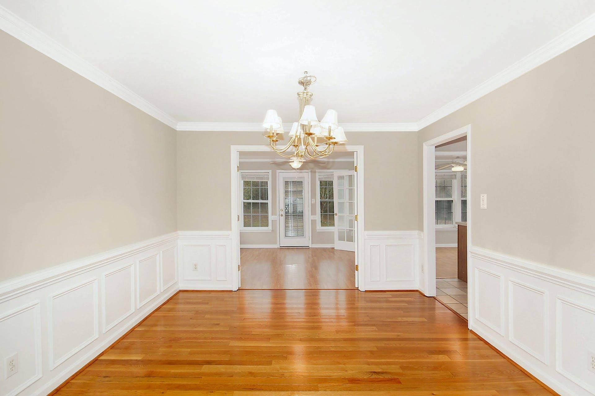 143 Susan Drive Garner, NC 27529 - Photo 7 of 27 a view of an empty room with chandelier
