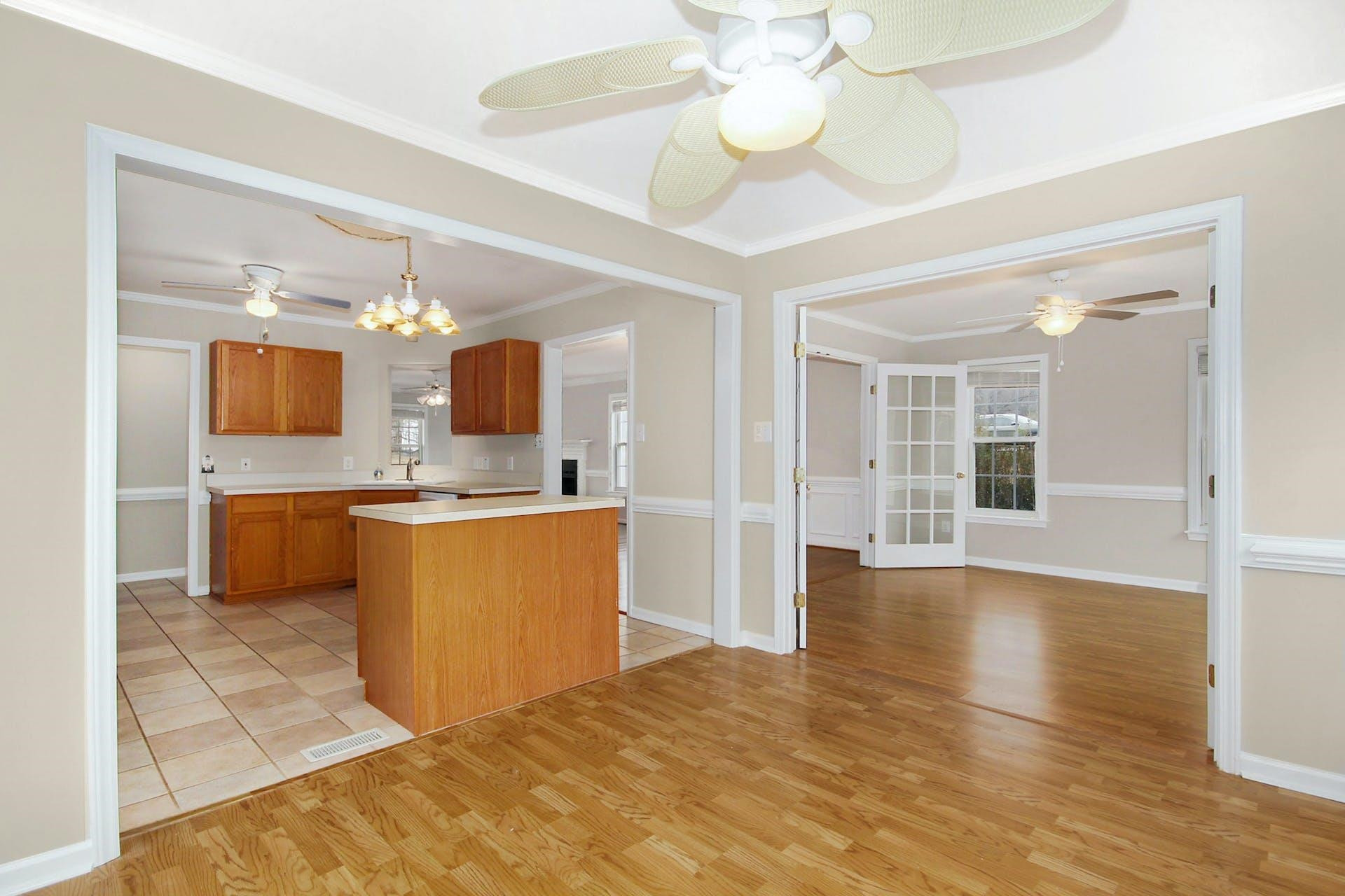 143 Susan Drive Garner, NC 27529 - Photo 8 of 27 a large kitchen with a sink and chandelier