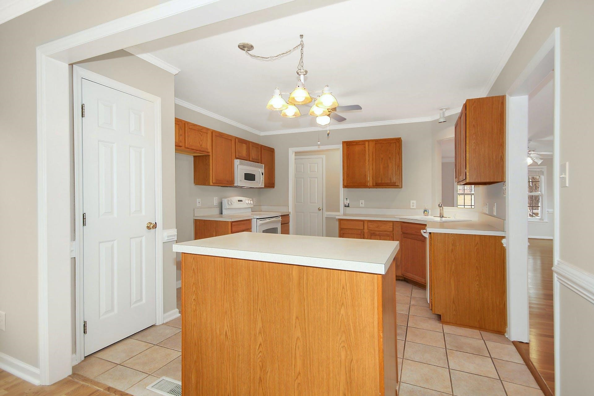143 Susan Drive Garner, NC 27529 - Photo 9 of 27 a spacious bathroom with a sink a mirror and a shower