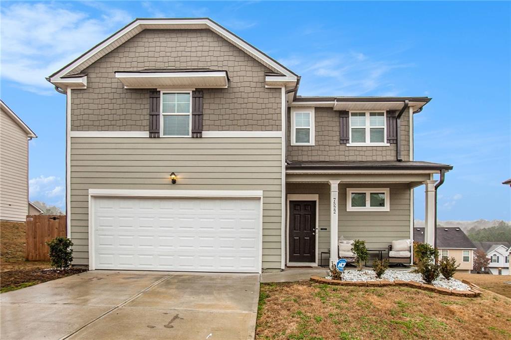 7522 Congregation Street Fairburn, GA 30213 - Photo 1 of 1 a front view of a house with a patio