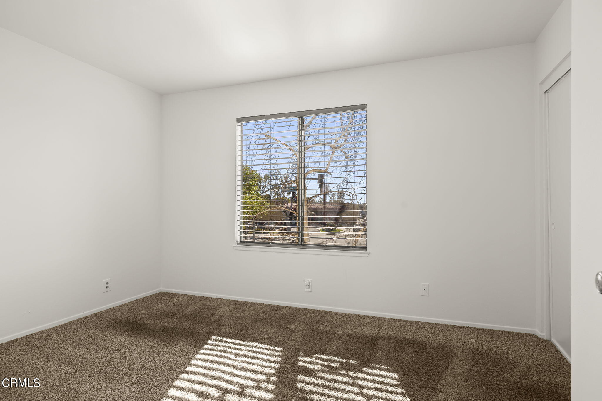1440 Friedrich Lane, Unit C Oxnard, CA 93033 - Photo 20 of 30 a view of an empty room with a window