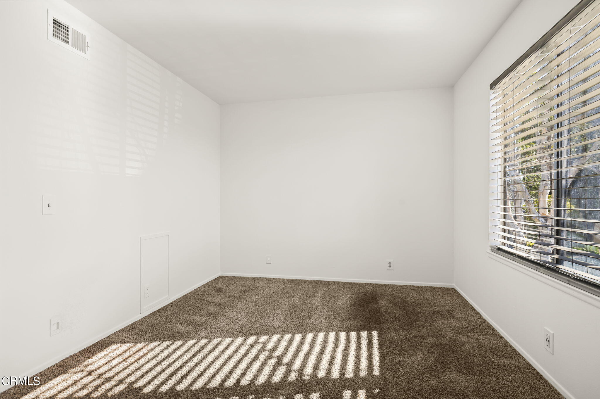 1440 Friedrich Lane, Unit C Oxnard, CA 93033 - Photo 23 of 30 a view of an empty room and window