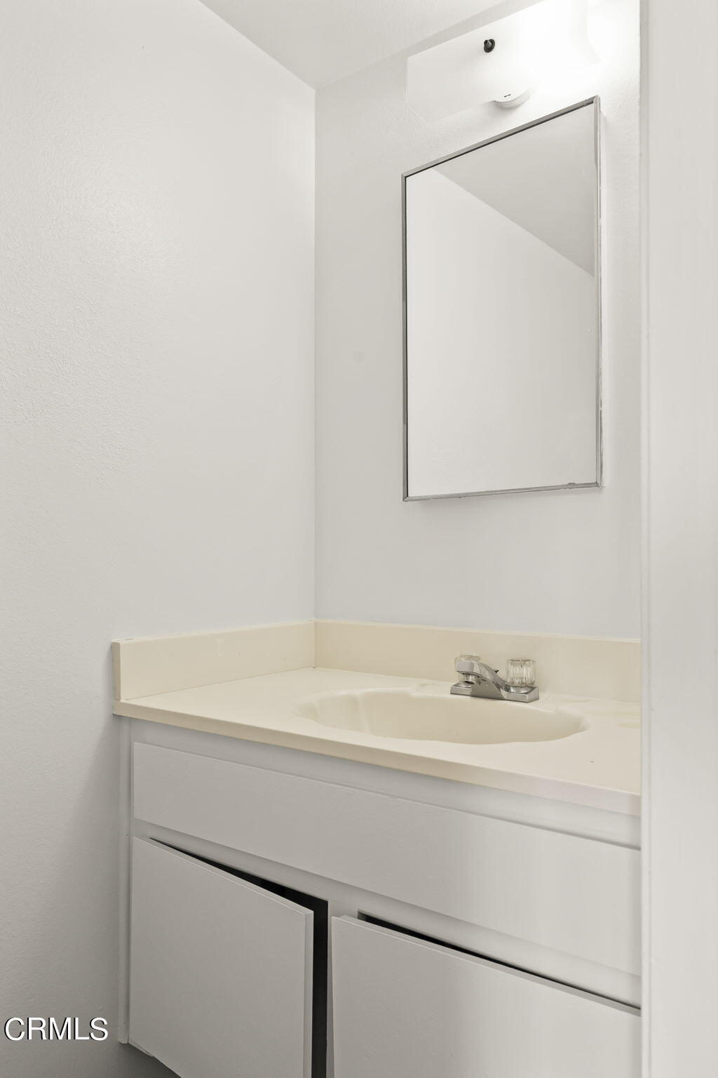 1440 Friedrich Lane, Unit C Oxnard, CA 93033 - Photo 24 of 30 a bathroom with a sink and a mirror