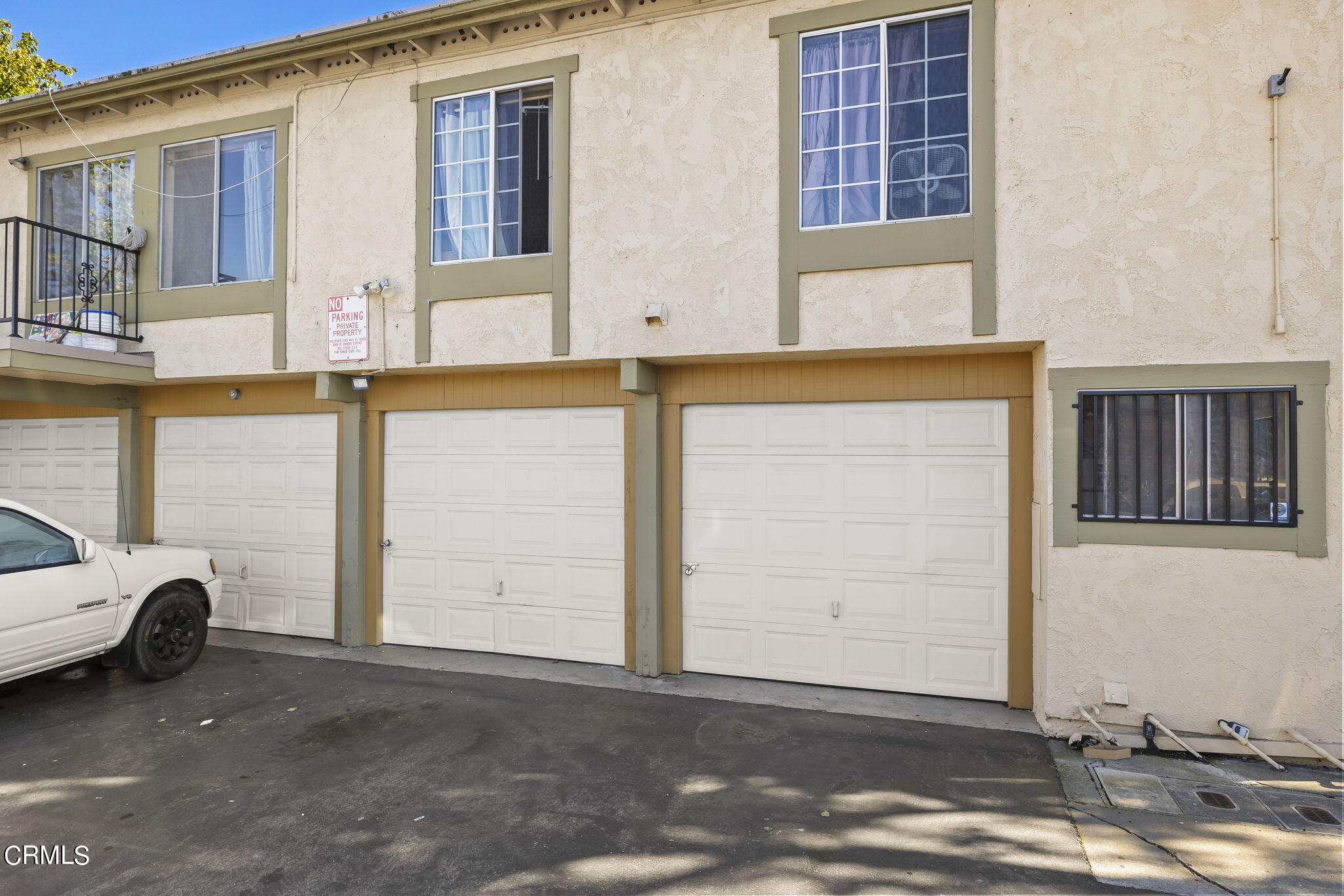 1440 Friedrich Lane, Unit C Oxnard, CA 93033 - Photo 29 of 30 a front view of a house with parking space