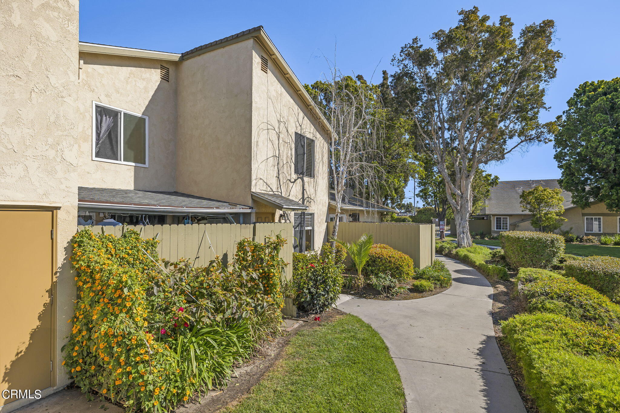 1440 Friedrich Lane, Unit C Oxnard, CA 93033 - Photo 3 of 30 a front view of a house with garden