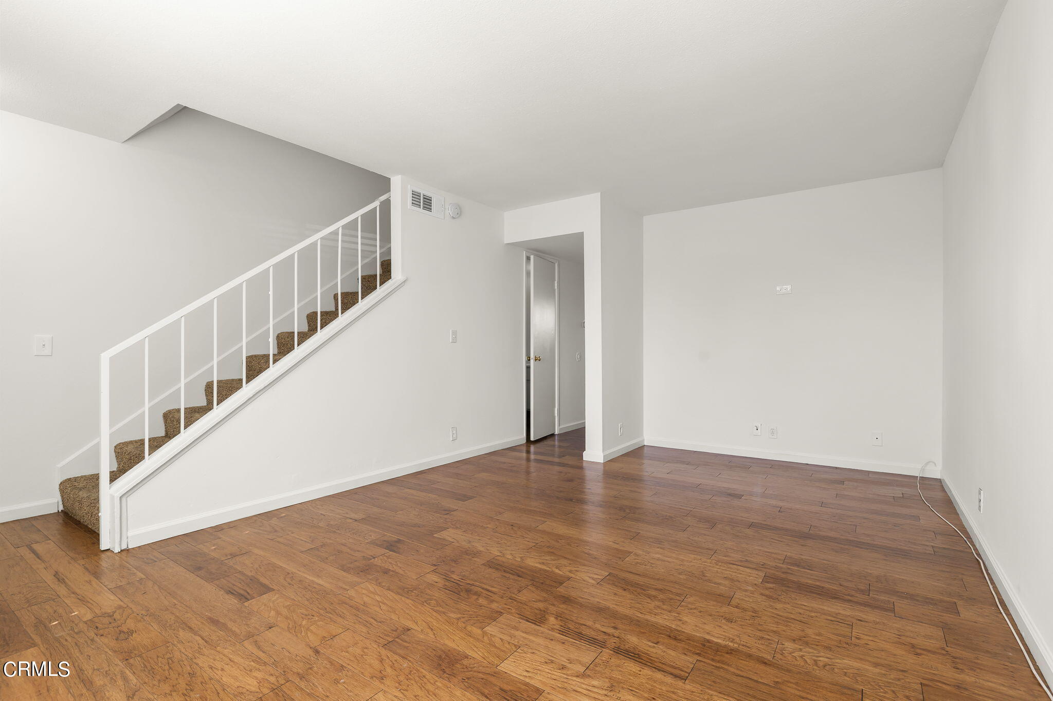 1440 Friedrich Lane, Unit C Oxnard, CA 93033 - Photo 6 of 30 a view of an entryway with wooden floor