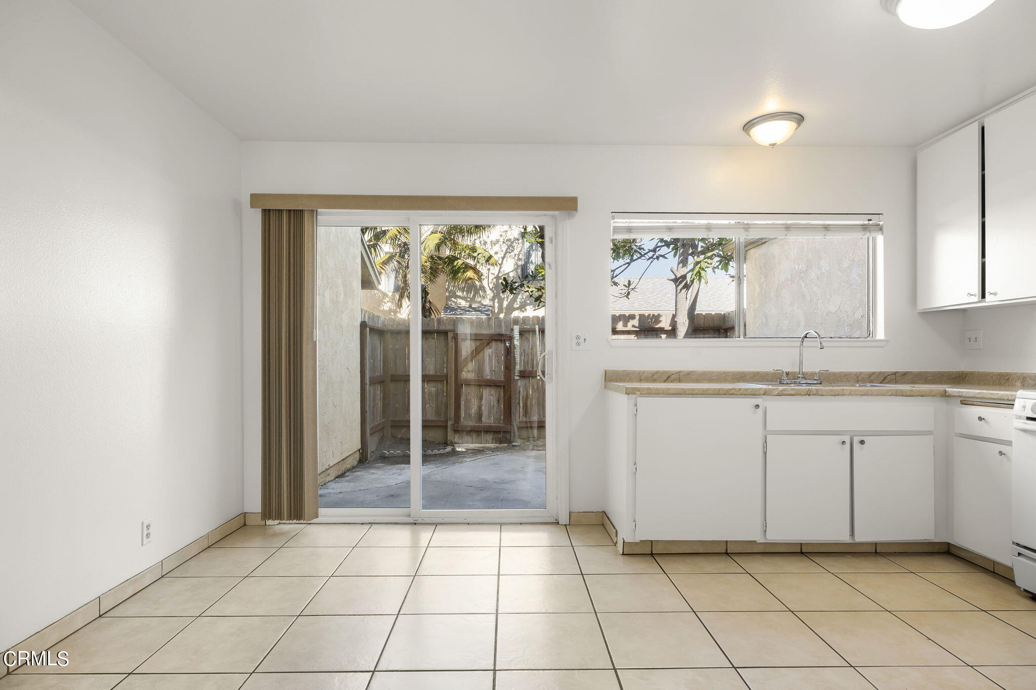 1440 Friedrich Lane, Unit C Oxnard, CA 93033 - Photo 9 of 30 a bathroom with a granite countertop sink a mirror and a shower