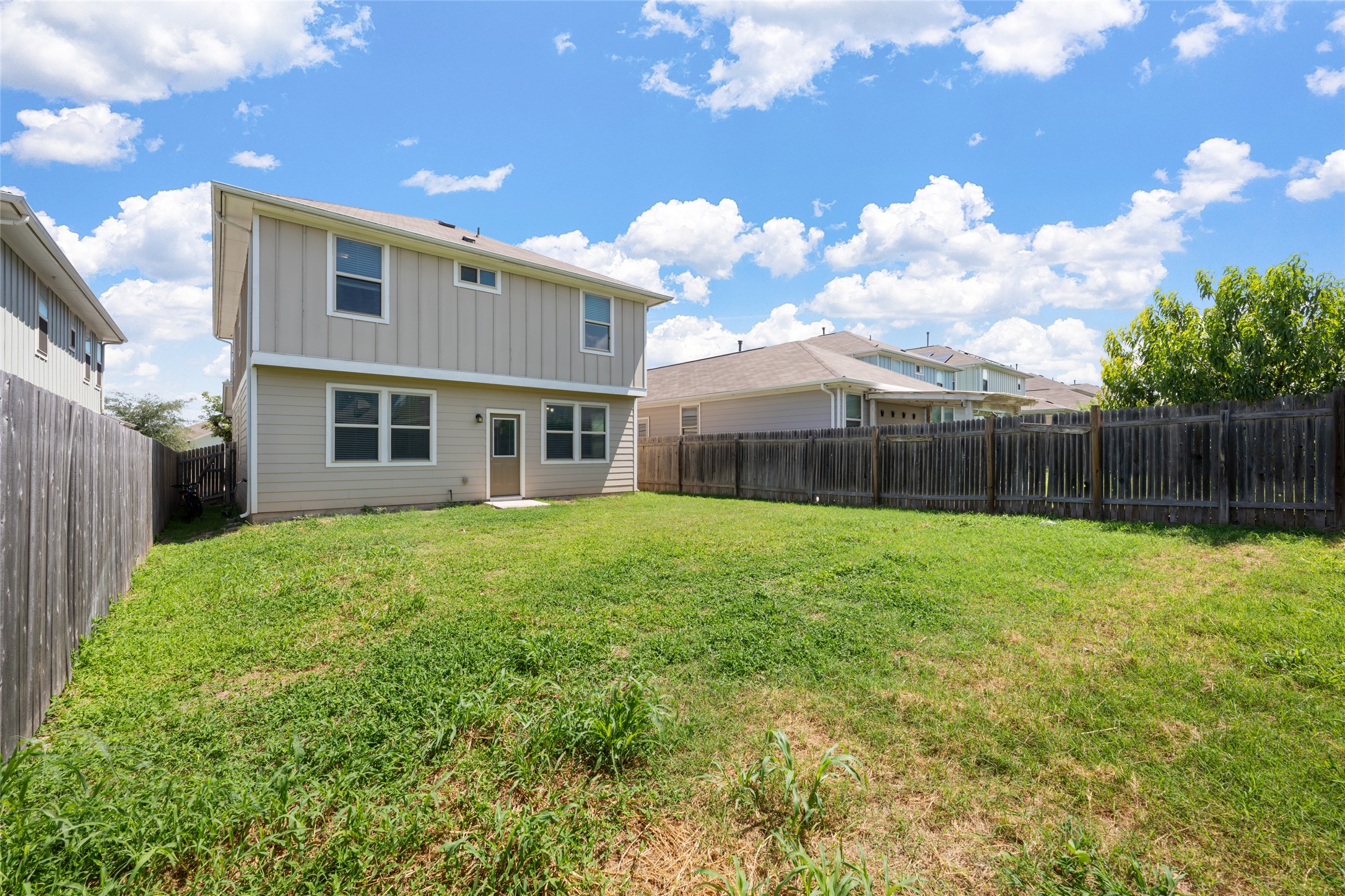 124 Guemal Road Buda, TX 78610 - Photo 37 of 40 A spacious, enclosed rear yard offers privacy and ample room for outdoor activities.
