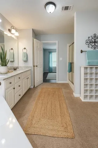 a view of a bathroom with sink and mirror