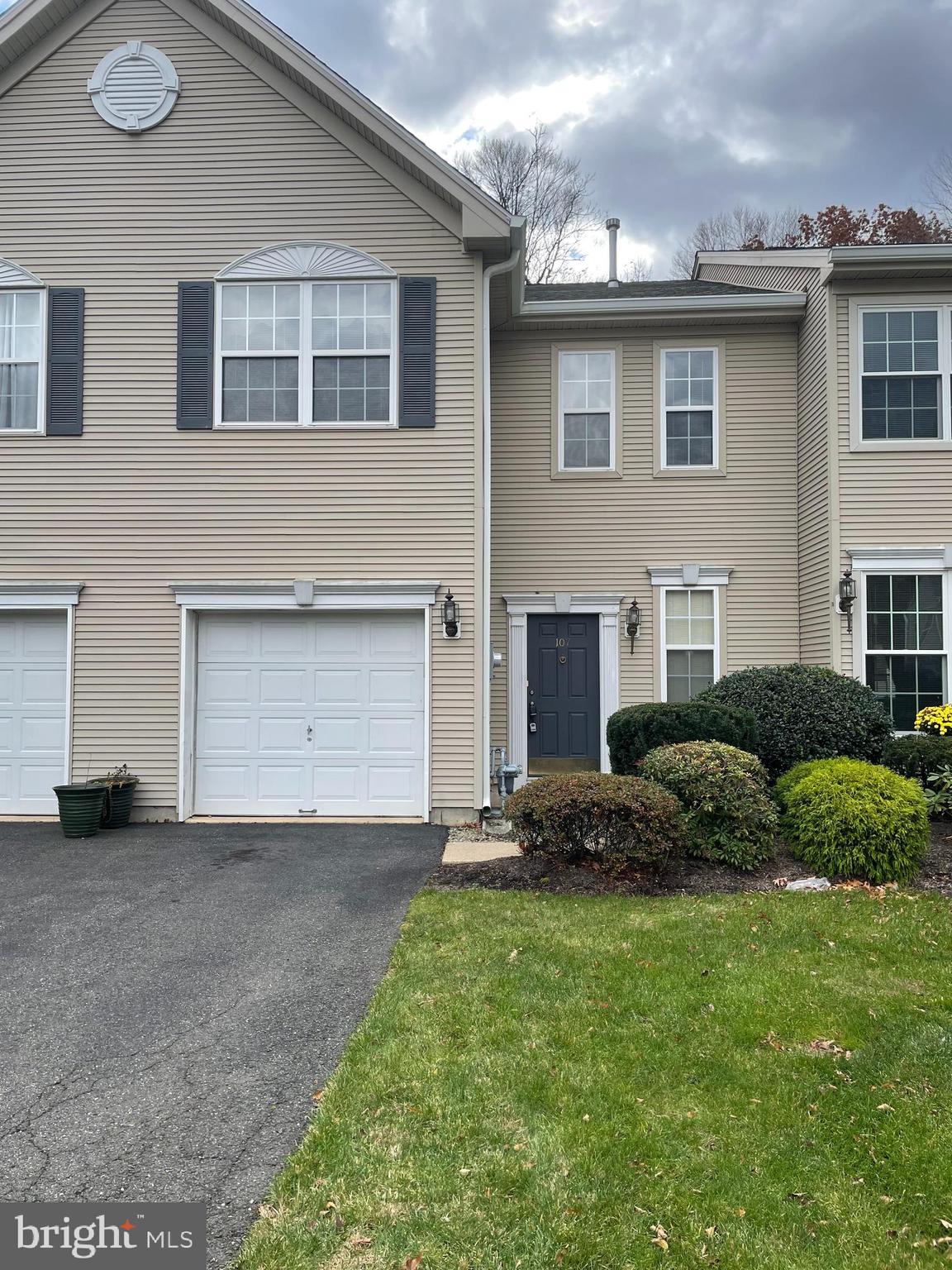 a view of a house with a garden and plants