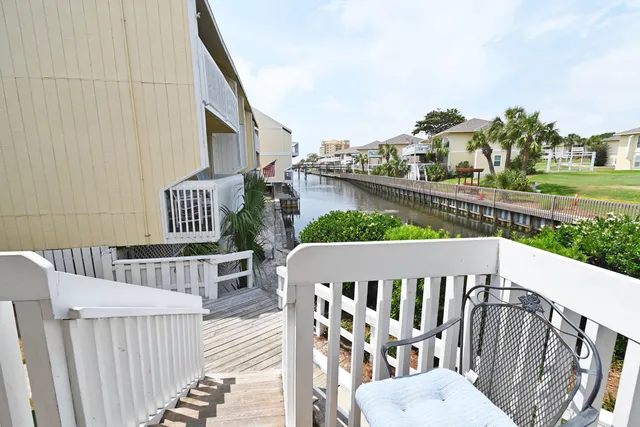 a view of a wooden deck and outdoor dining space