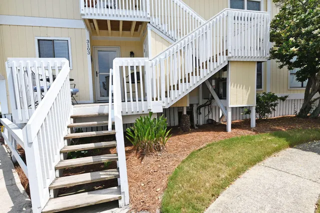 a view of balcony with wooden floor outdoor seating