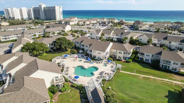 an aerial view of residential houses with outdoor space