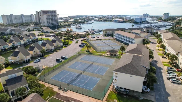an aerial view of residential houses with outdoor space