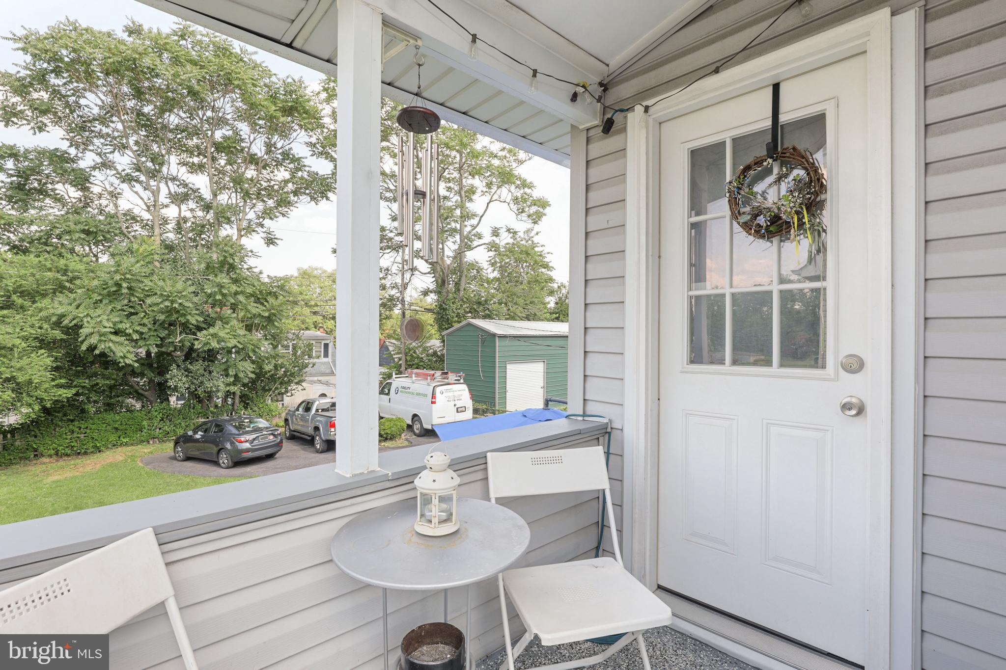 523 Elmwood Road Baltimore, MD 21206 - Photo 43 of 48 Rear porch that leads down to exterior storage