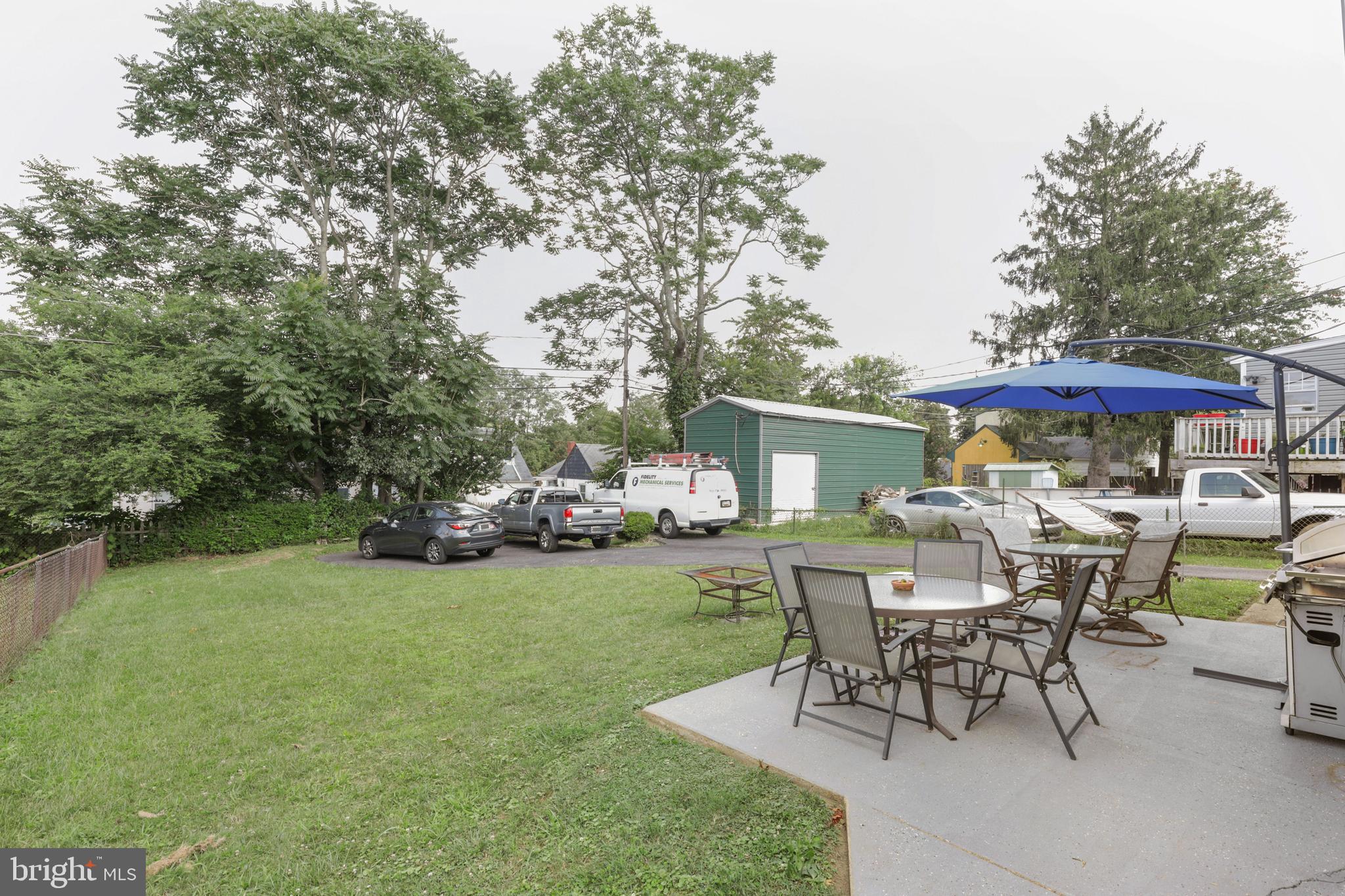 523 Elmwood Road Baltimore, MD 21206 - Photo 44 of 48 Yard, concrete patio, and parking.