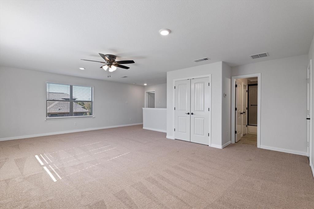 3511 West J E Woody Road Springtown, TX 76082 - Photo 26 of 34 Unfurnished living room with light colored carpet, recessed lighting, and a ceiling fan
