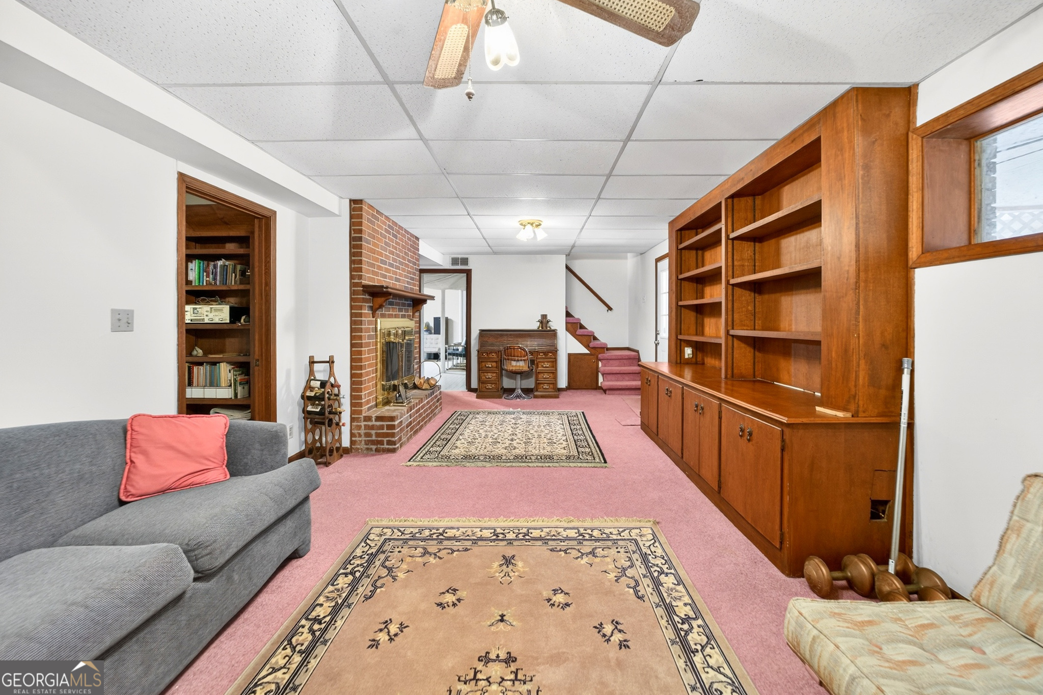 881 Rockbridge Road Southwest Lilburn, GA 30047 - Photo 22 of 44 a living room with furniture rug and wooden floor