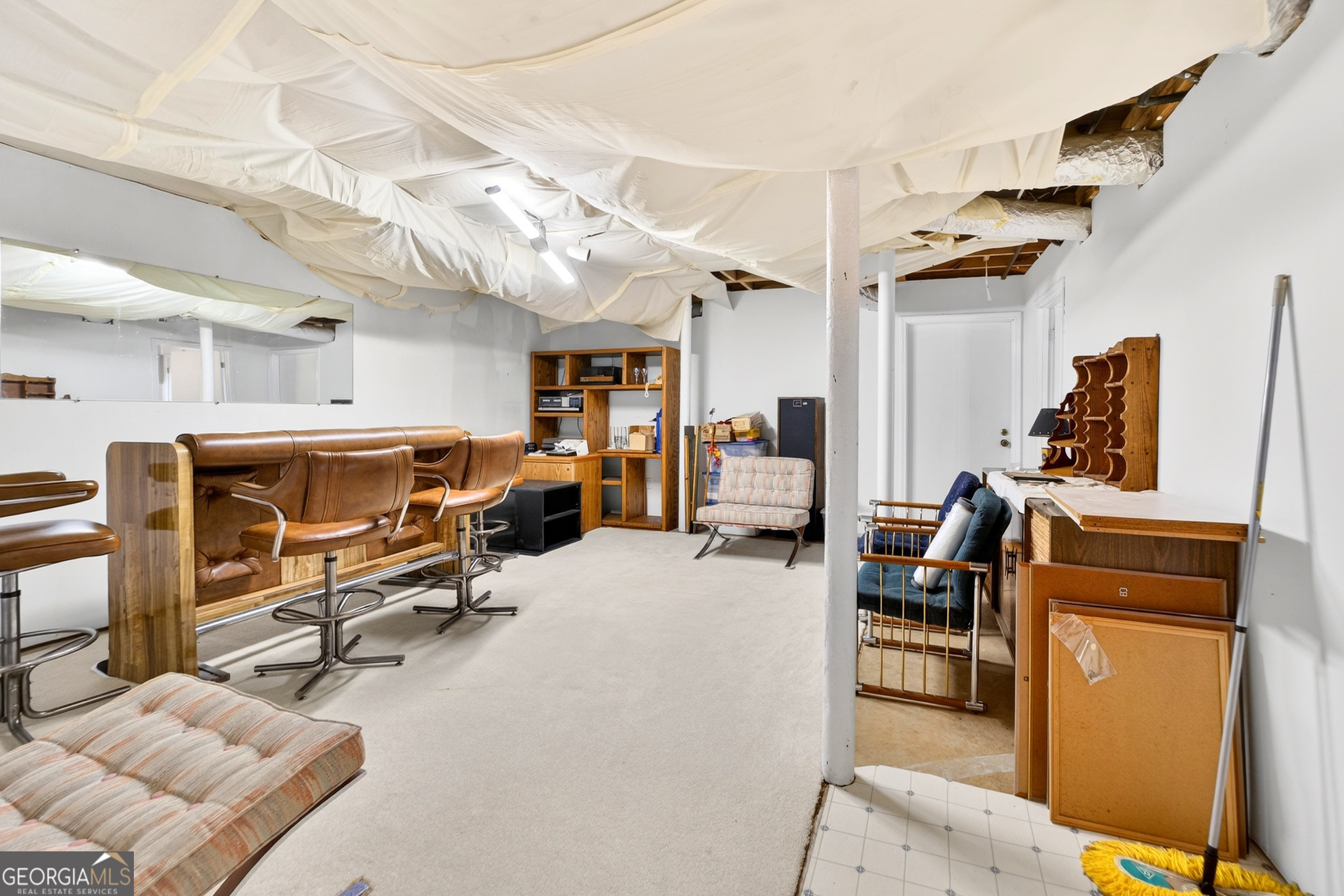 881 Rockbridge Road Southwest Lilburn, GA 30047 - Photo 24 of 44 a view of a livingroom with workspace and a couch