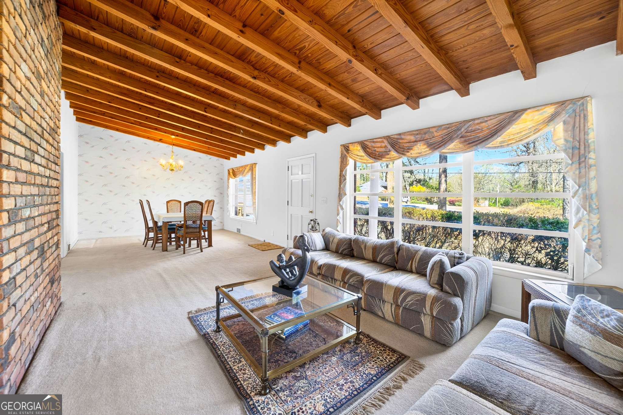 881 Rockbridge Road Southwest Lilburn, GA 30047 - Photo 5 of 44 a living room with furniture and a large window