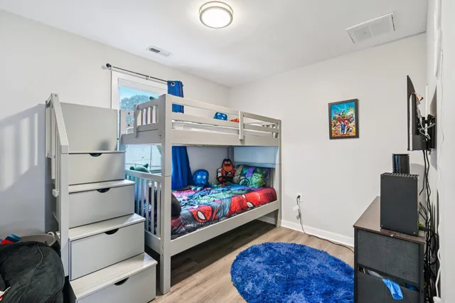 a bed room with furniture and a window