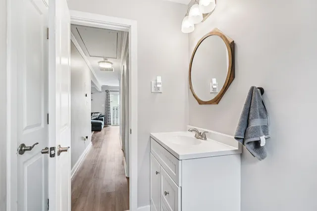 a bathroom with a sink and a mirror