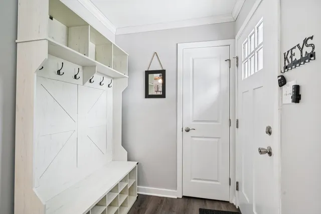 a view of an entryway with wooden floor