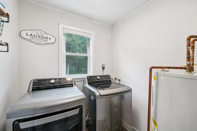 a view of storage and utility room with washer and dryer