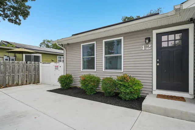 a front view of a house with garden