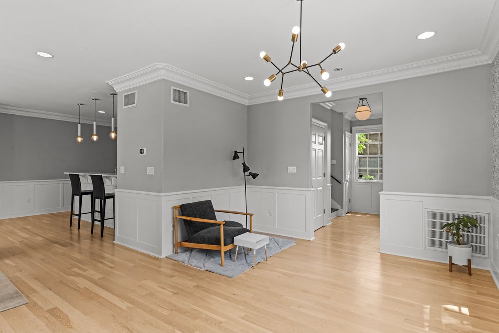 1609 Hartford Road, Unit A Austin, TX 78703 - Photo 19 of 39 Blonde hardwood floors and crisp wainscoting define this adaptable living area.