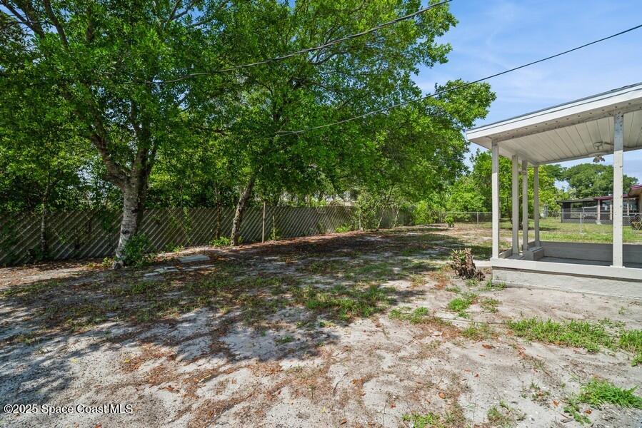 1671 Ollie Street Cocoa, FL 32922 - Photo 10 of 11 a backyard of a house with a table and chairs