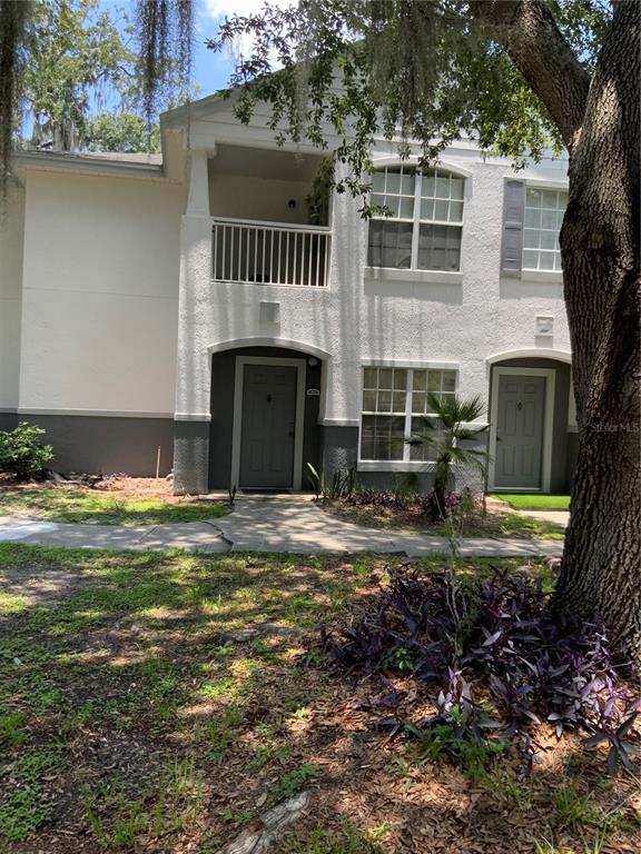 4348 South Kirkman Road, Unit 803 Orlando, FL 32811 - Photo 1 of 1 a view of a house with a yard