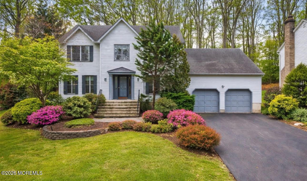 a front view of a house with yard