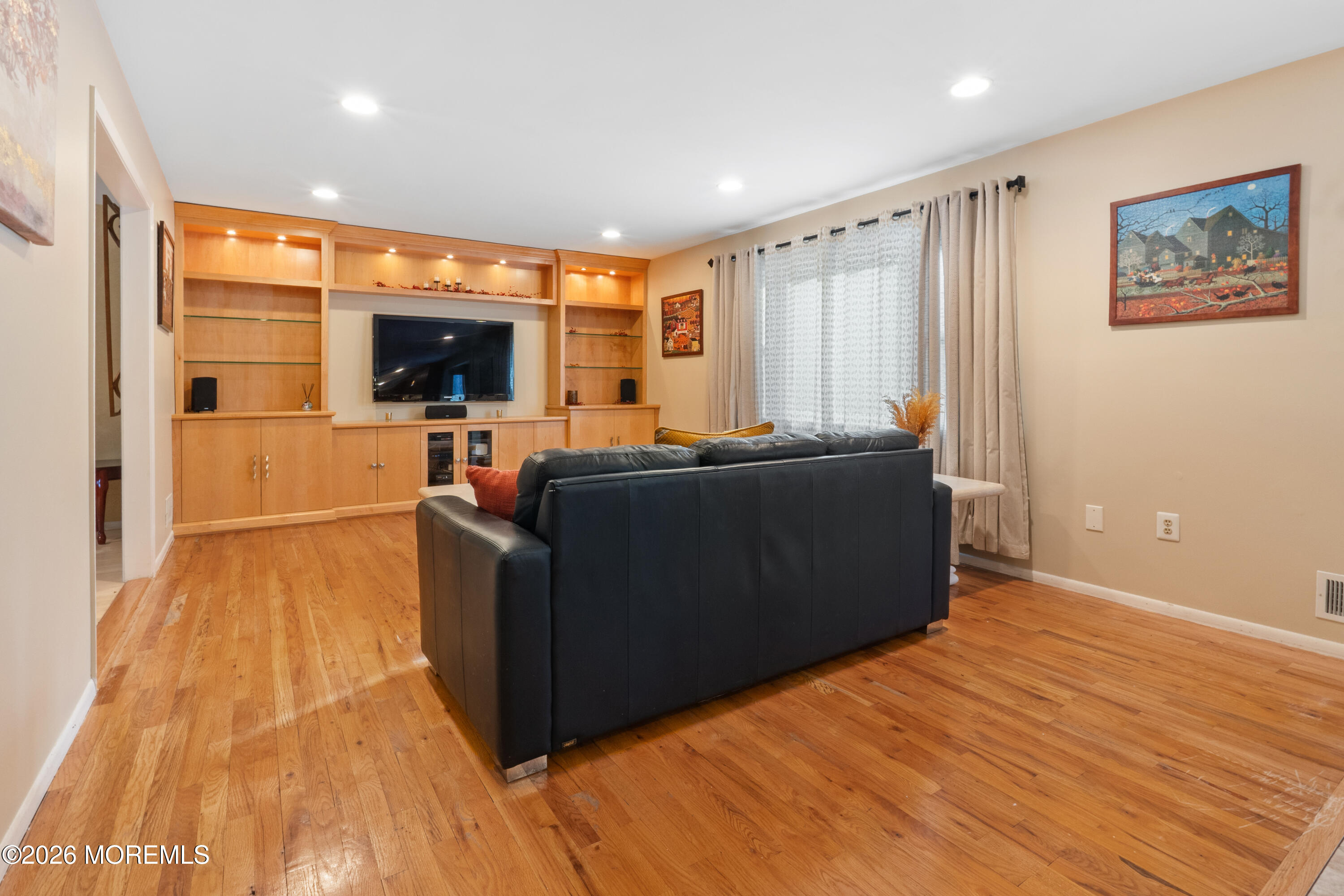 25 Cherokee Road East Brunswick, NJ 08816 - Photo 11 of 34 a living room with furniture and a flat screen tv