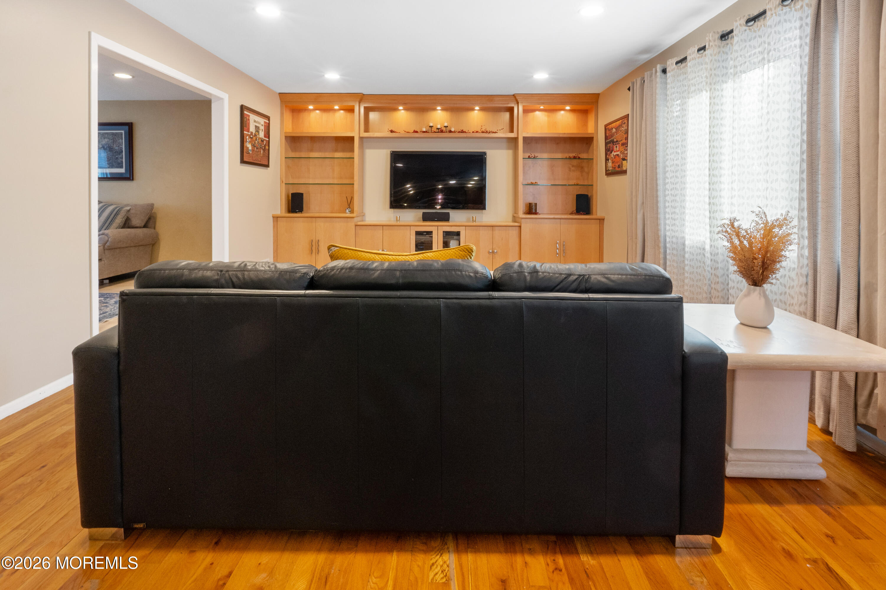 25 Cherokee Road East Brunswick, NJ 08816 - Photo 12 of 34 a living room with furniture and a flat screen tv