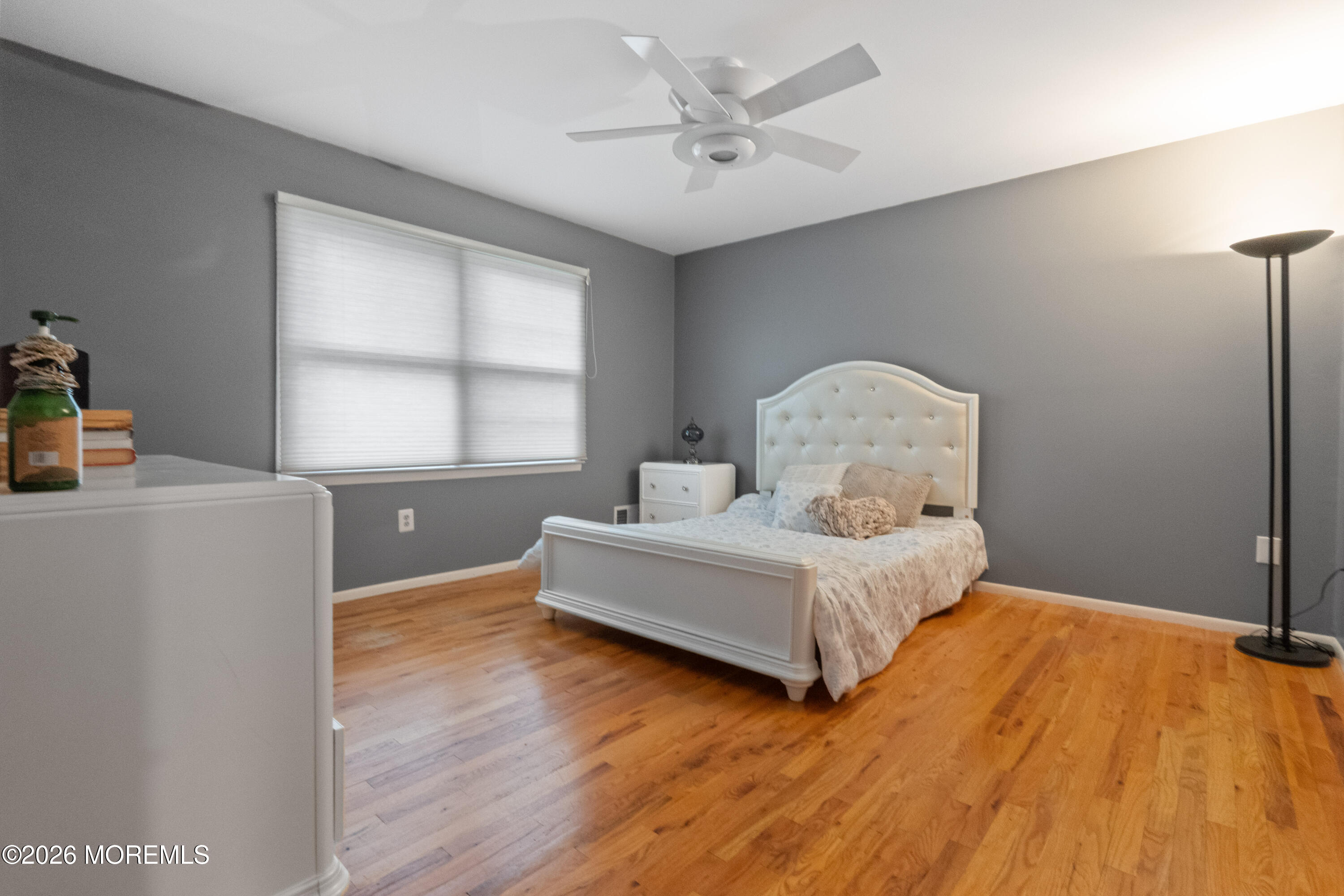 25 Cherokee Road East Brunswick, NJ 08816 - Photo 22 of 34 a bedroom with a bed and wooden floor