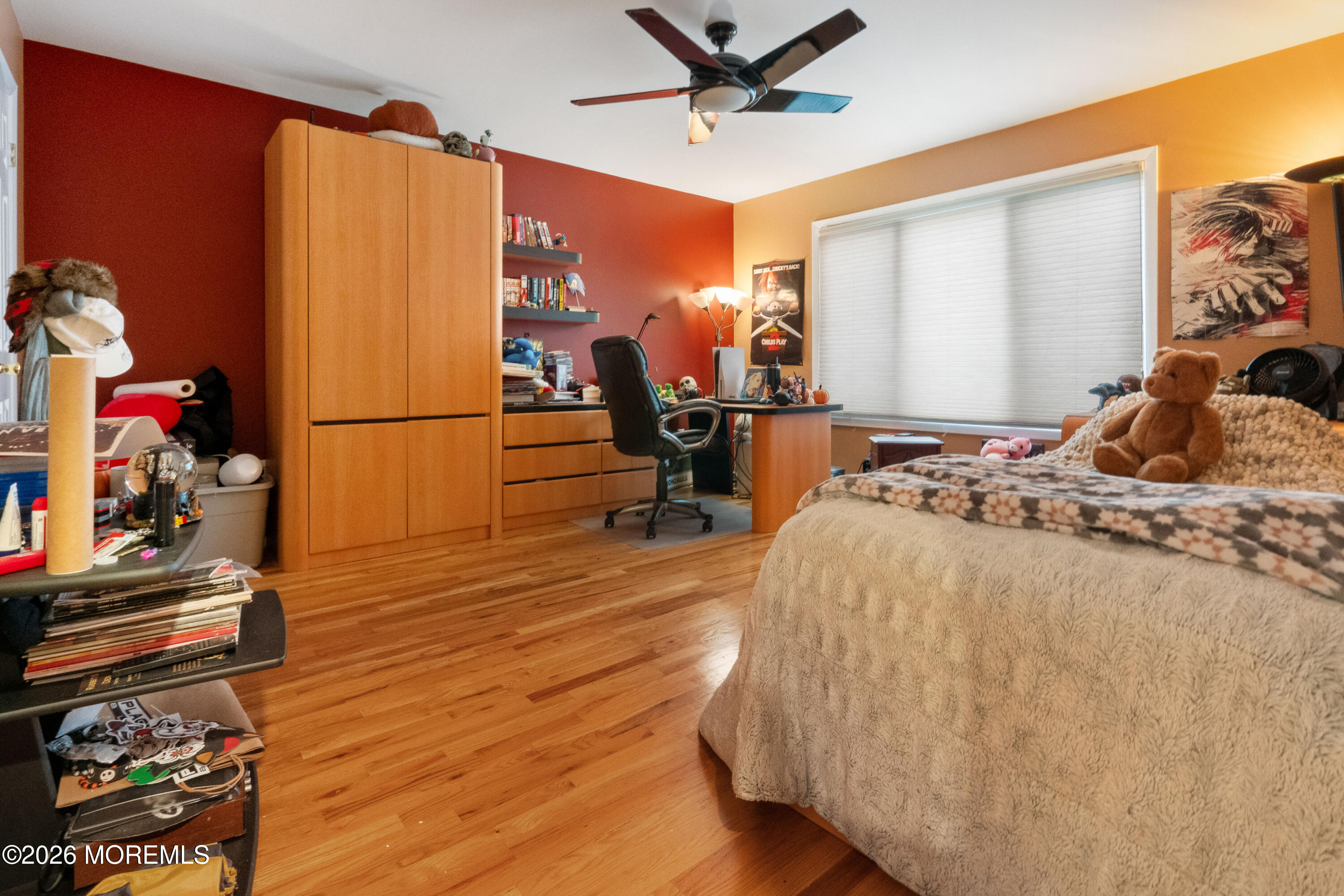 25 Cherokee Road East Brunswick, NJ 08816 - Photo 23 of 34 a bedroom with wooden floor and a bed