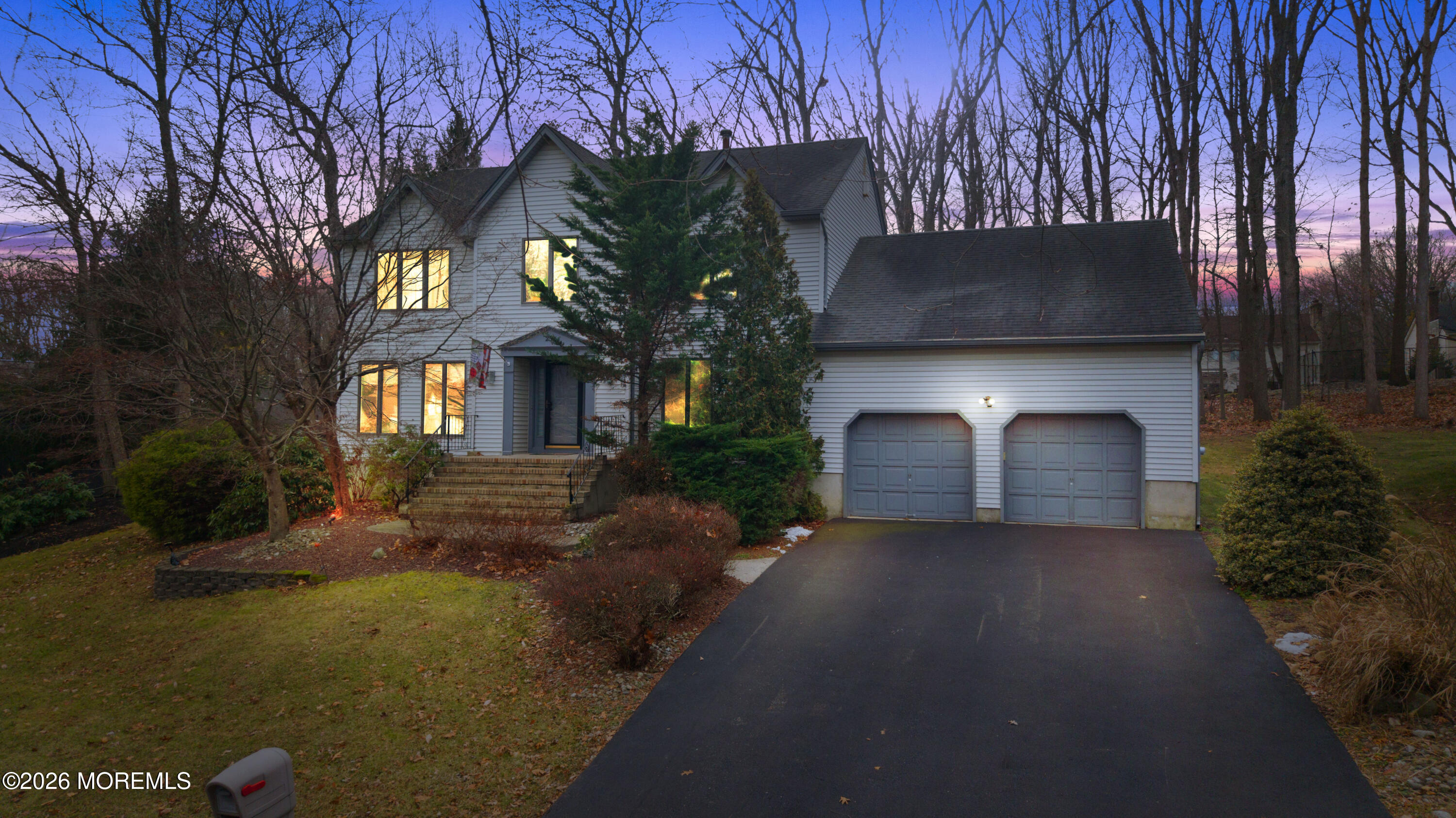 25 Cherokee Road East Brunswick, NJ 08816 - Photo 3 of 34 a front view of a house with a yard and garage