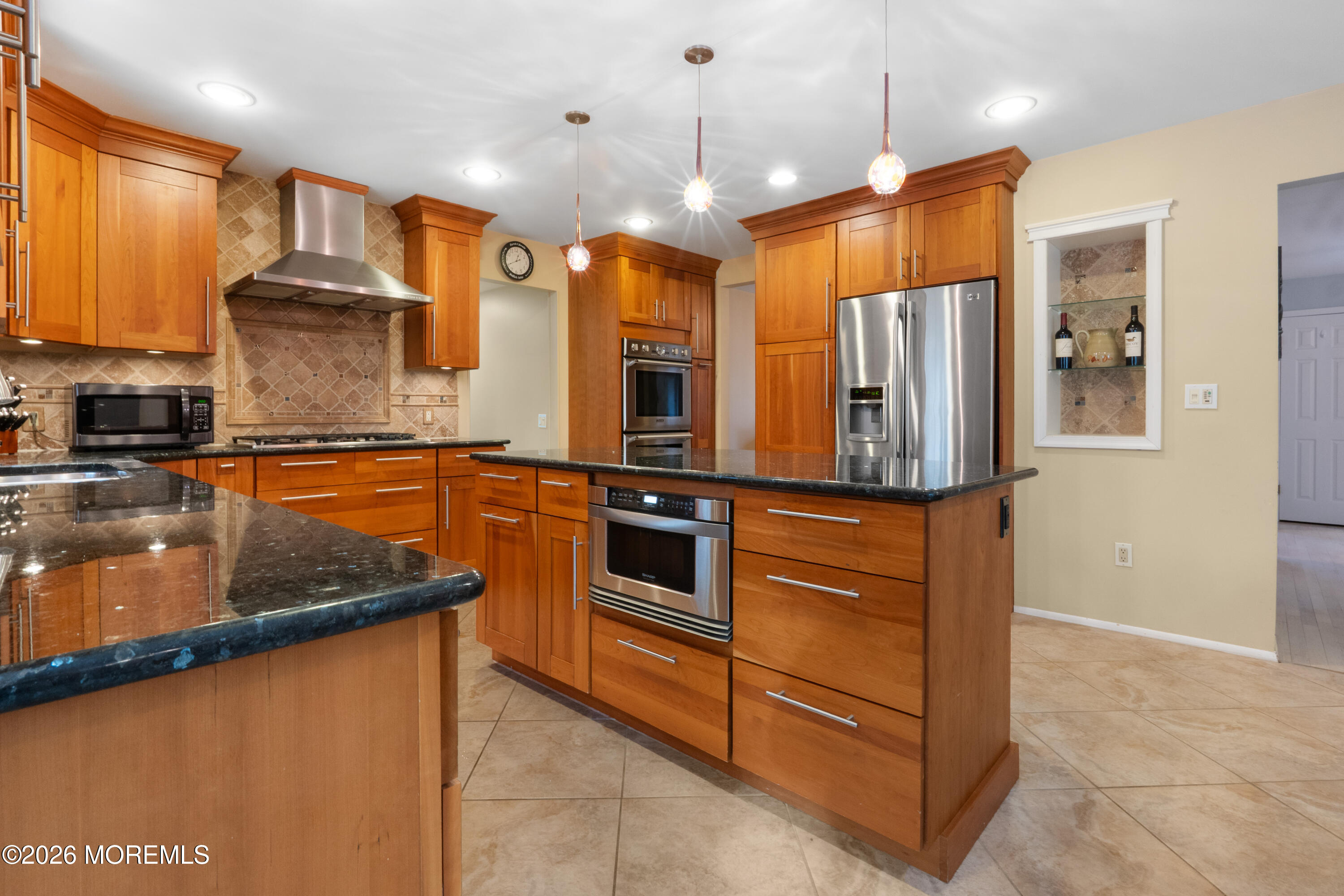 25 Cherokee Road East Brunswick, NJ 08816 - Photo 8 of 34 a kitchen with stainless steel appliances granite countertop a refrigerator and a sink
