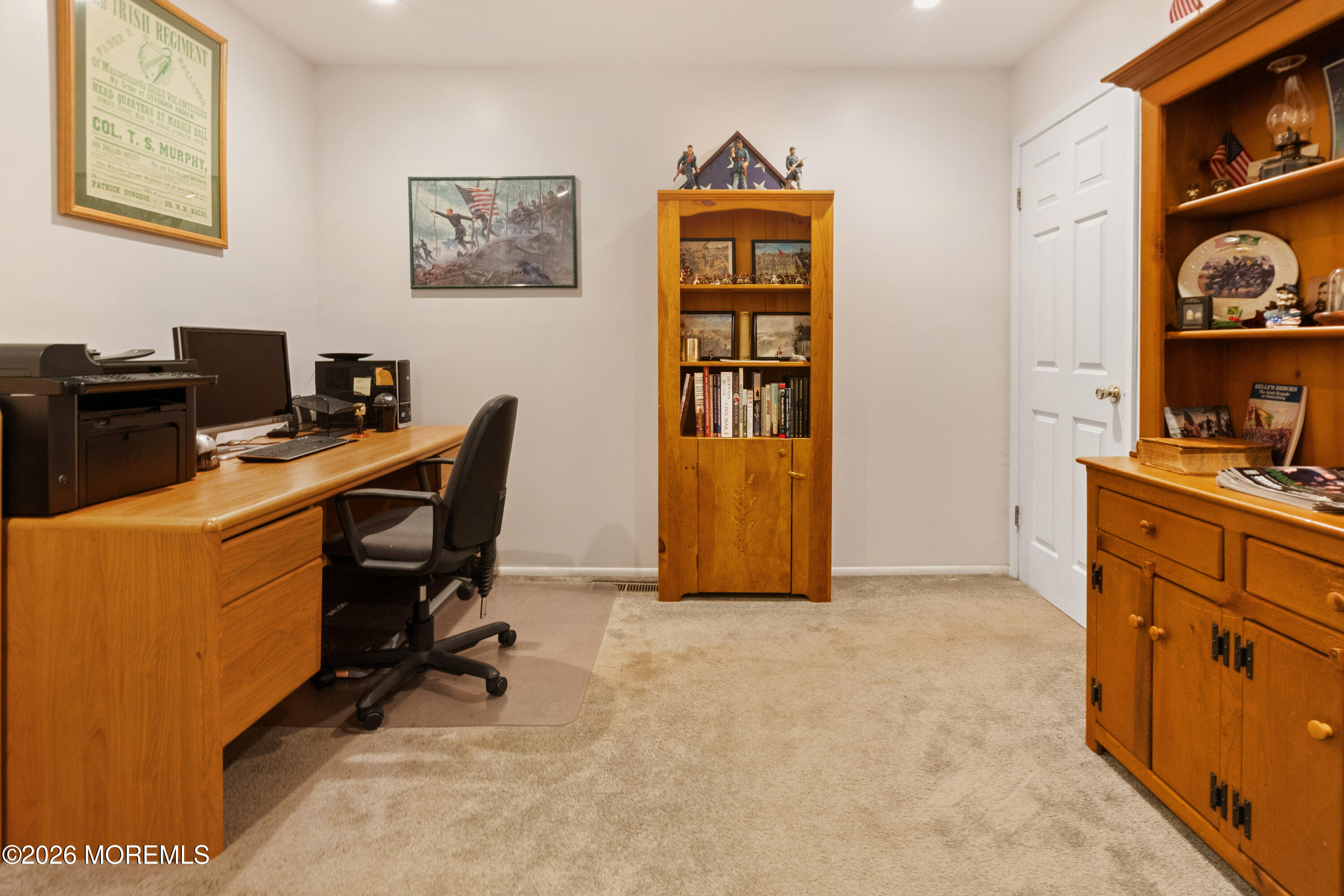 25 Cherokee Road East Brunswick, NJ 08816 - Photo 10 of 34 a view of a workspace with furniture and a bookshelf