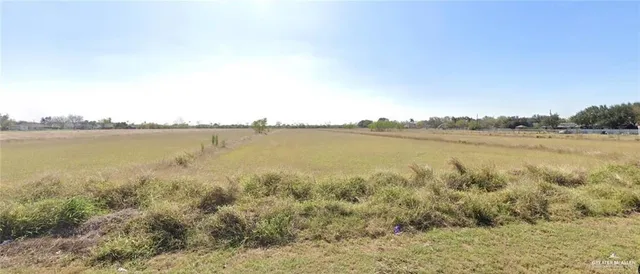a view of a lake with houses in the back