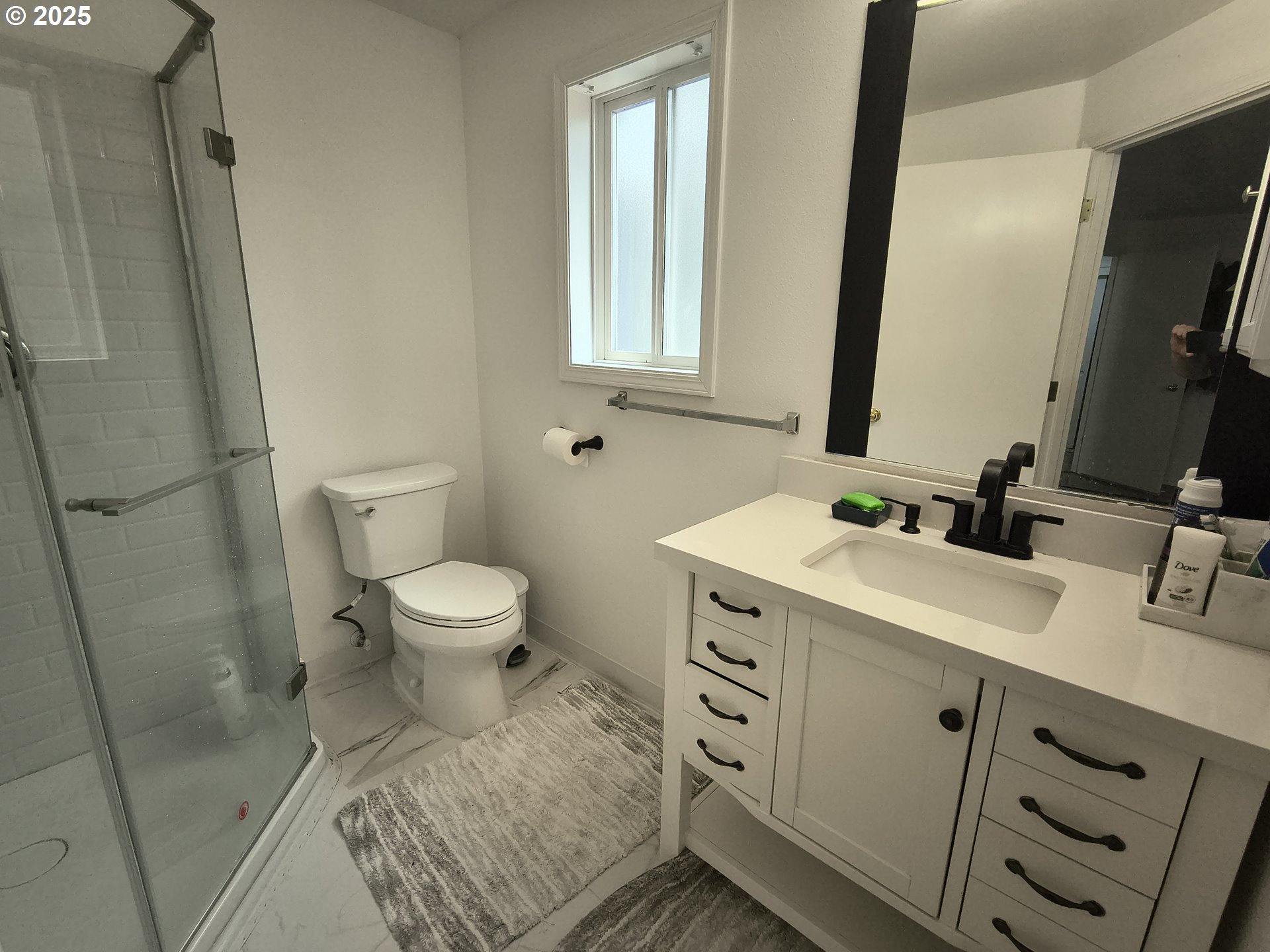 7321 Southwest 52nd Avenue Portland, OR 97219 - Photo 40 of 47 a bathroom with a sink toilet double vanity and mirror