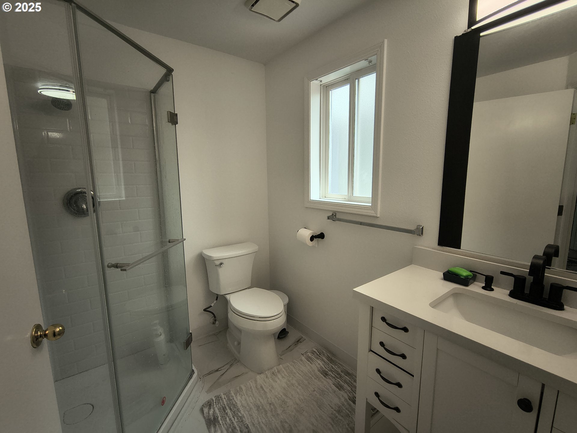 7321 Southwest 52nd Avenue Portland, OR 97219 - Photo 41 of 47 a bathroom with a sink toilet and shower