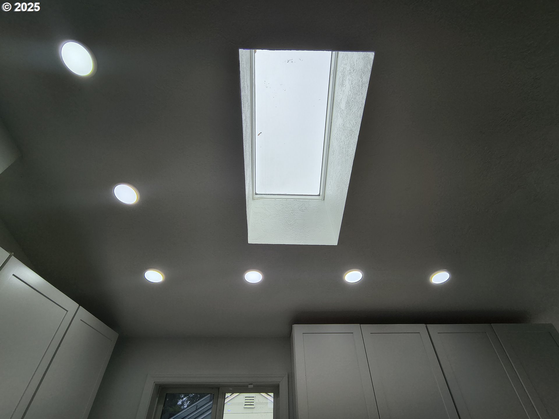 7321 Southwest 52nd Avenue Portland, OR 97219 - Photo 43 of 47 a bathroom with a light fixture and a window