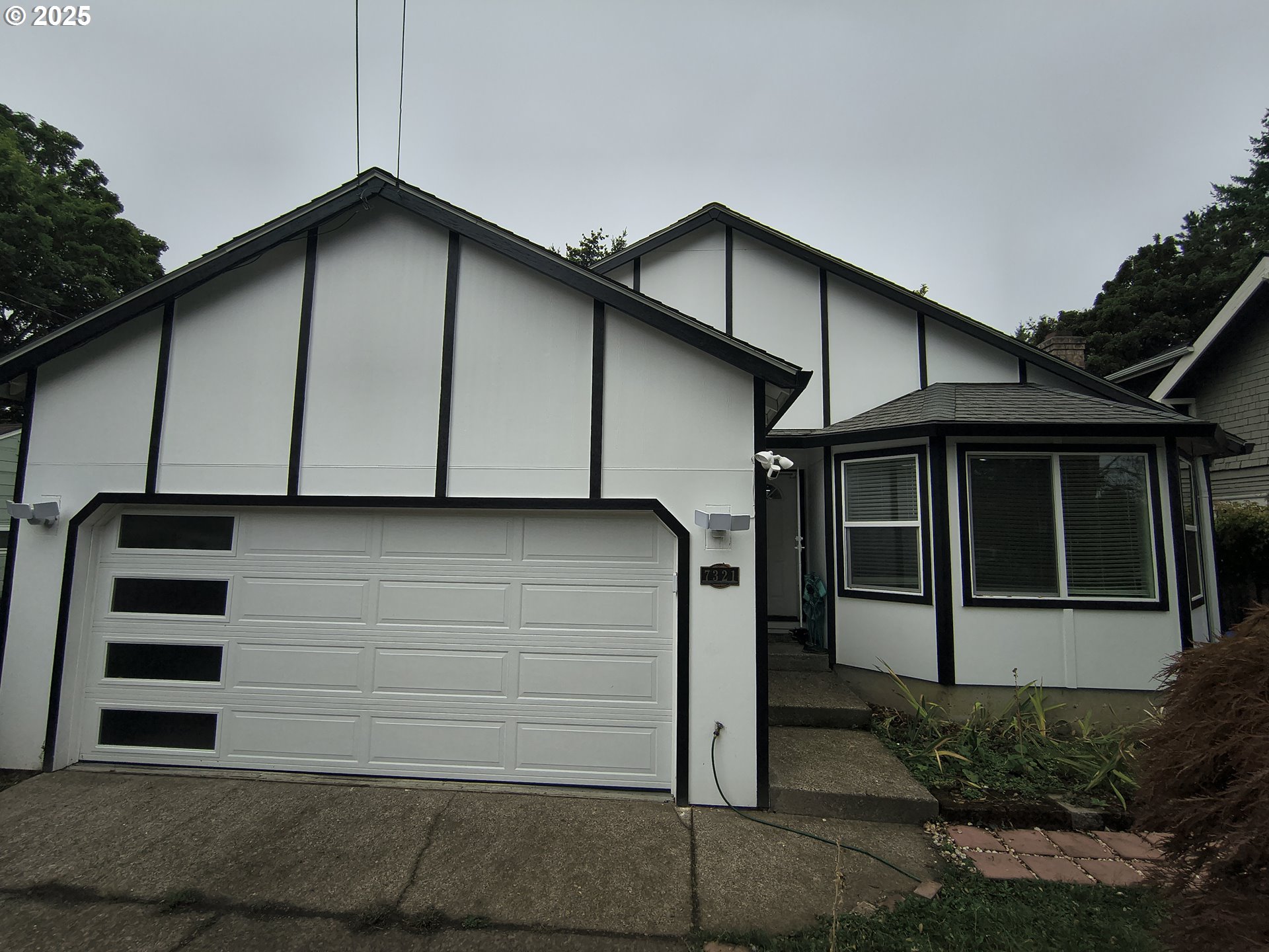 7321 Southwest 52nd Avenue Portland, OR 97219 - Photo 44 of 47 a view of a house with a garage