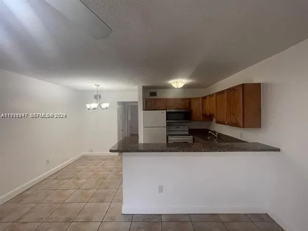 a view of a kitchen with a sink
