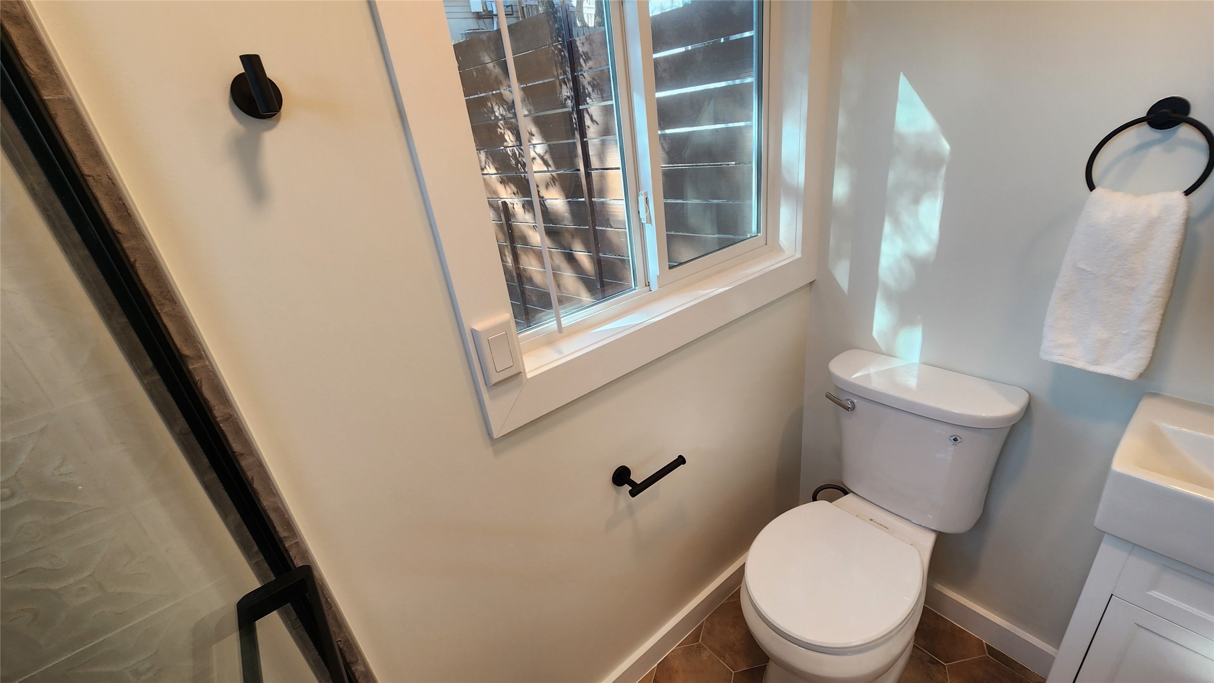 1134 Lott Avenue Austin, TX 78721 - Photo 20 of 33 a white toilet sitting next to a shower