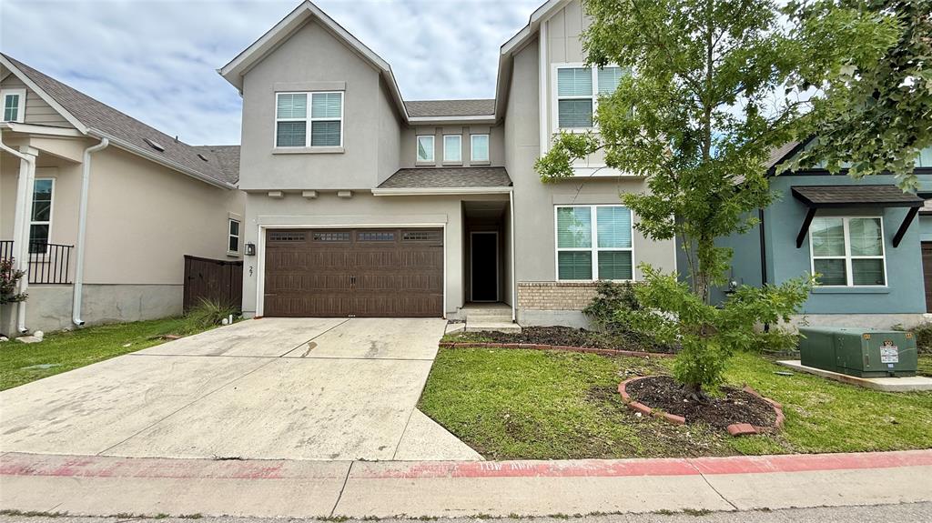 601 C-Bar Ranch Trail, Unit 27 Cedar Park, TX 78613 - Photo 1 of 29 Contemporary two-story residence featuring a stucco exterior with a stone accent base