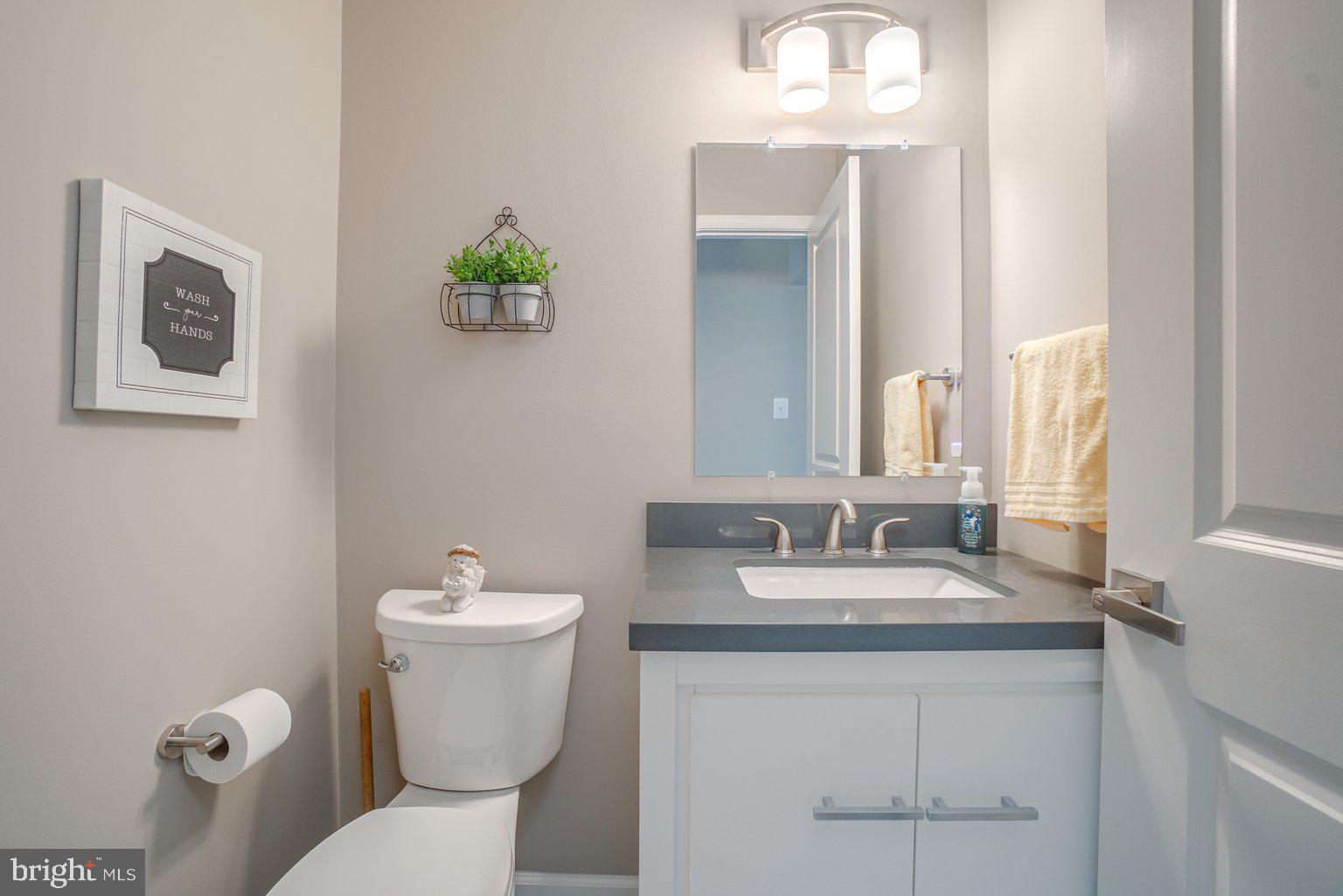 9316 Ramblebrook Road Baltimore, MD 21236 - Photo 18 of 41 Powder Room With Quartz Vanity Top